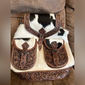 Cowhide and tooled leather backpack